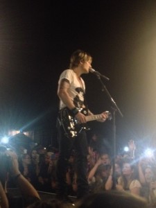Keith Urban front and center singing  one of his latest hits "Cop Car"
