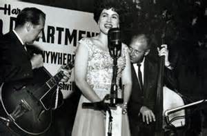 Patsy Cline singing with a guitar and a double bass