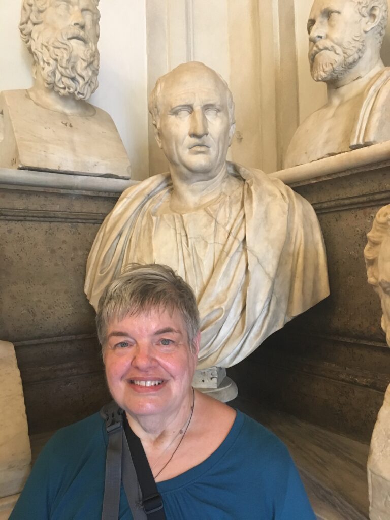 Davida in front of bust of Cicero at the Vatican